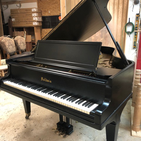Restored black baby piano