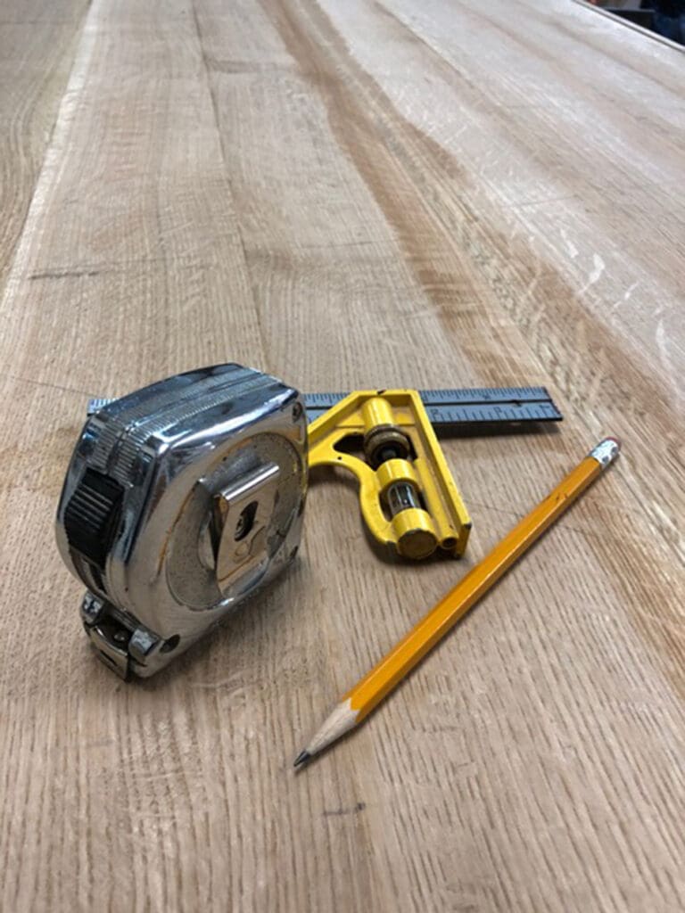 Custom library desk with pencil and tape measure