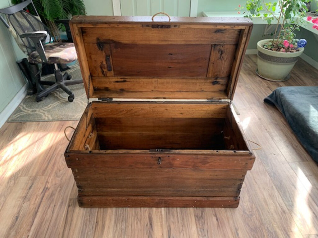 Newly refinished open wooden trunk